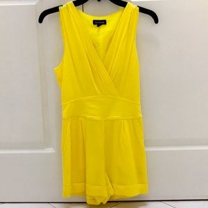 Bebe yellow romper size xxs new without tags